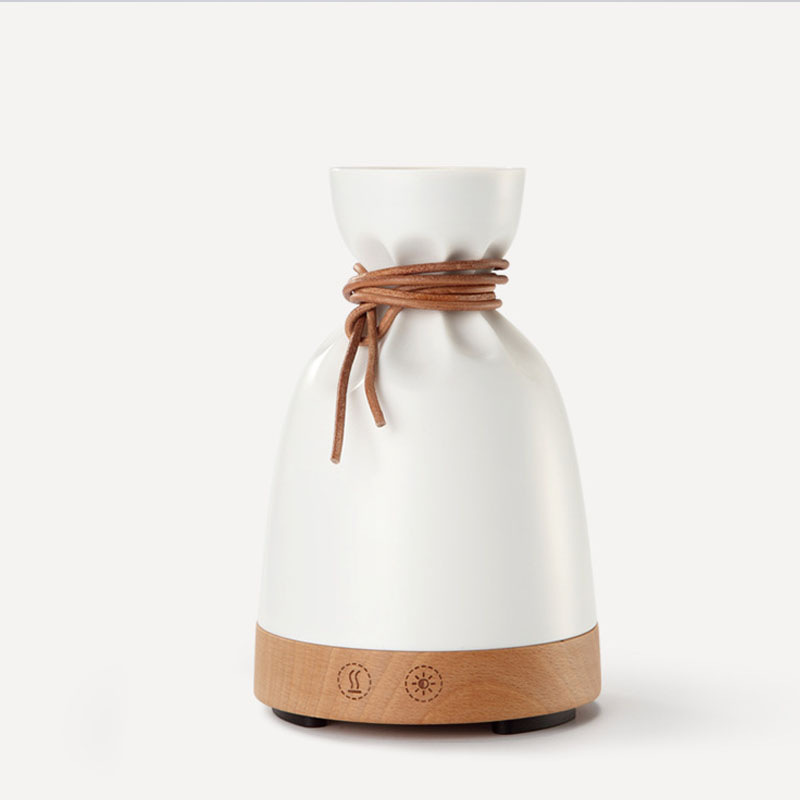 White diffuser with brown accents on a white background