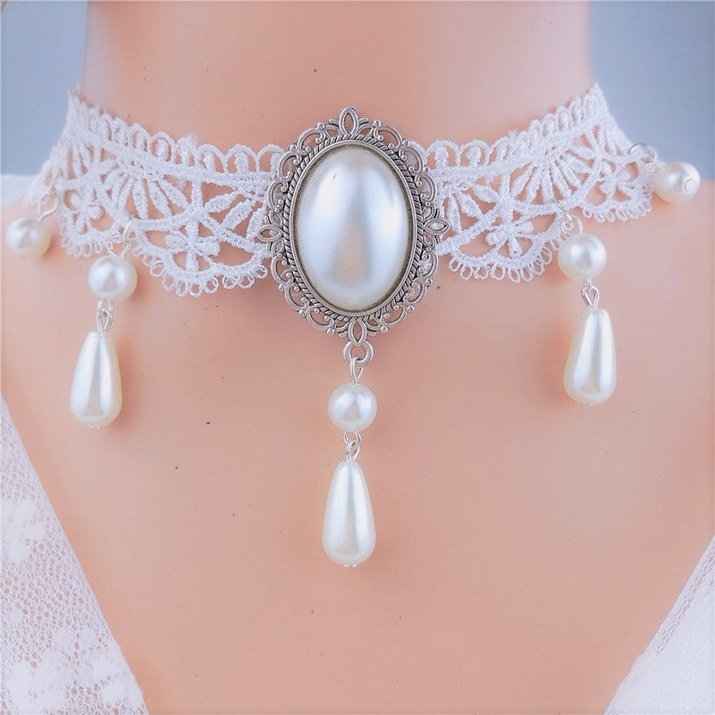 Pearl choker necklace with lace detail on a mannequin