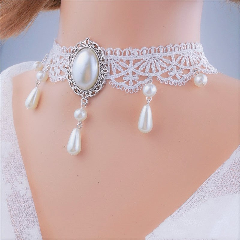 Pearl choker necklace on a mannequin with a plain background