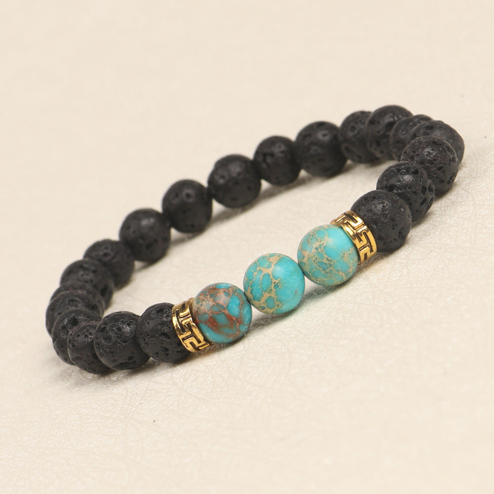 Bracelet with black beads and turquoise beads on a beige background