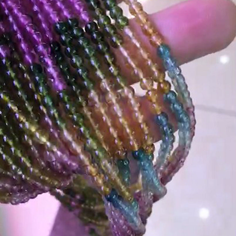 Close-up of multicolored beaded bracelets on a hand