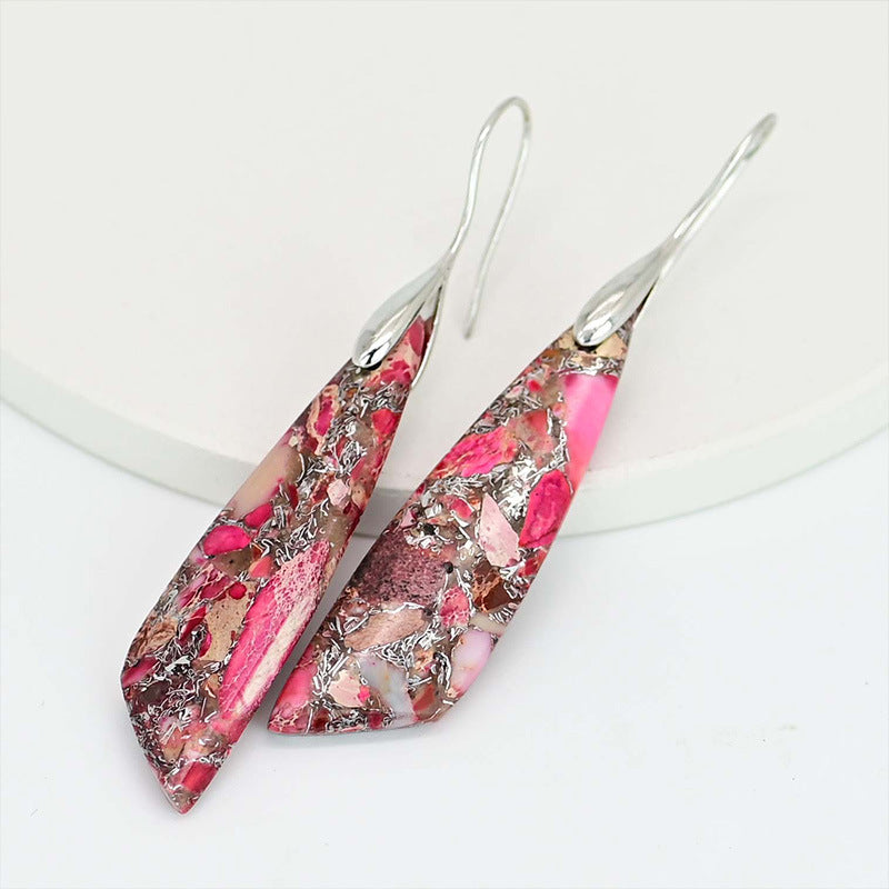 Pair of pink and brown marbled earrings on a white background