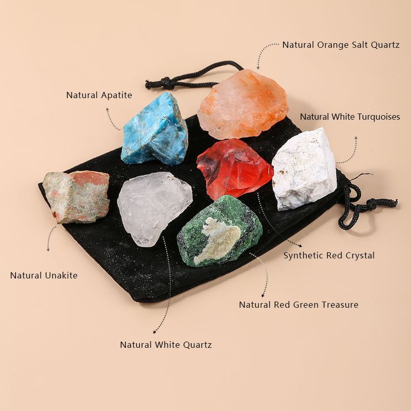 Collection of various crystals on a black drawstring bag with labels on a beige background