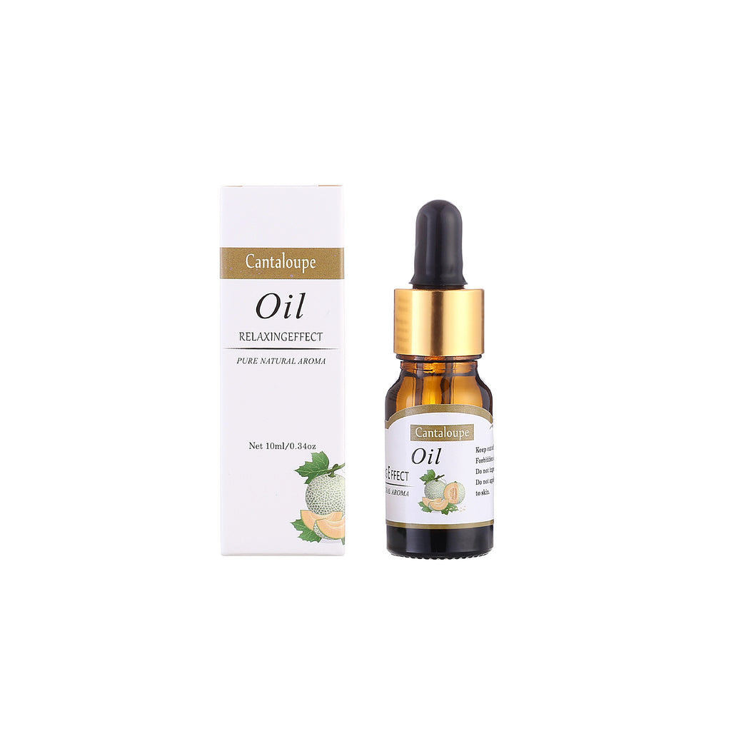 Cantaloupe oil bottle with dropper and packaging on a white background