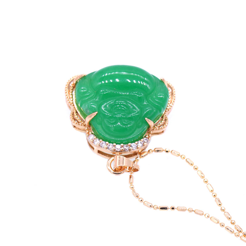 Green jade pendant with rose gold frame and chain on white background