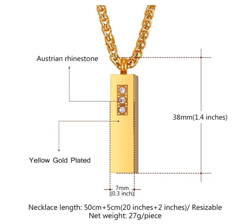 Gold necklace with pendant and measurement details on a white background
