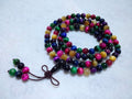 Multicolored beaded necklace on a white background
