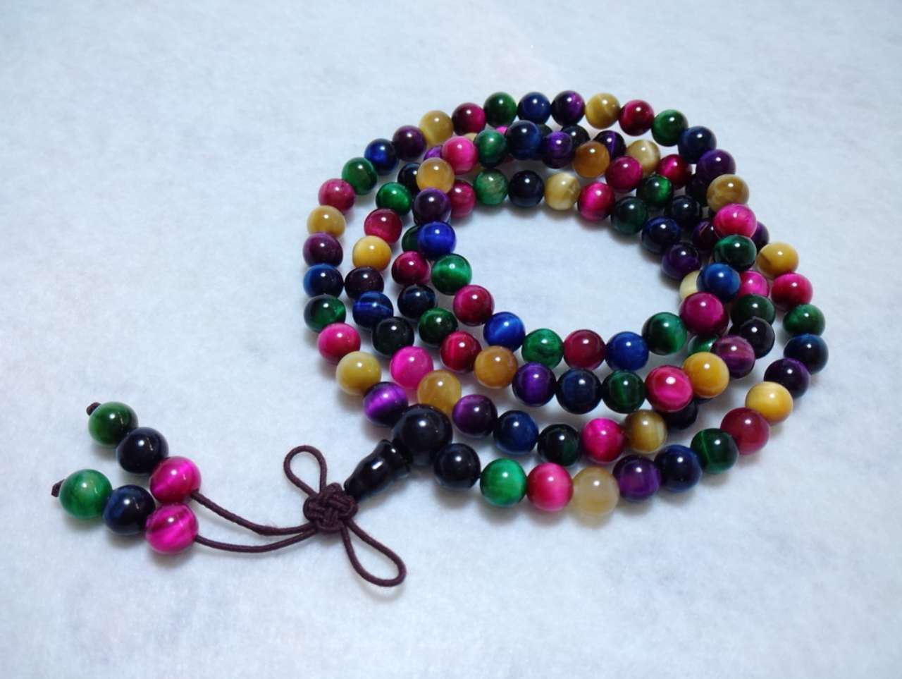 Multicolored beaded necklace on a white background