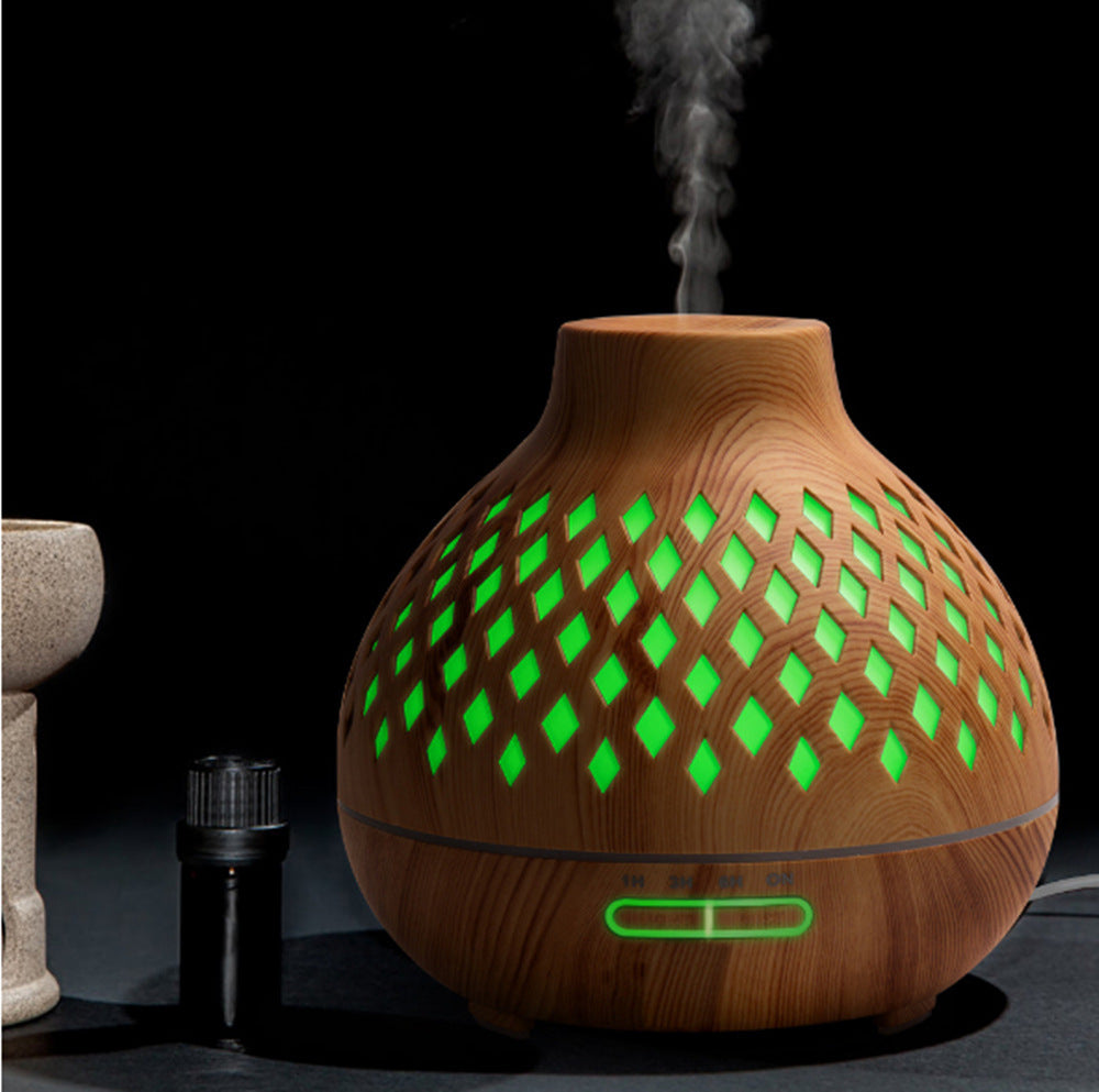 Wooden diffuser with green lights on a dark background