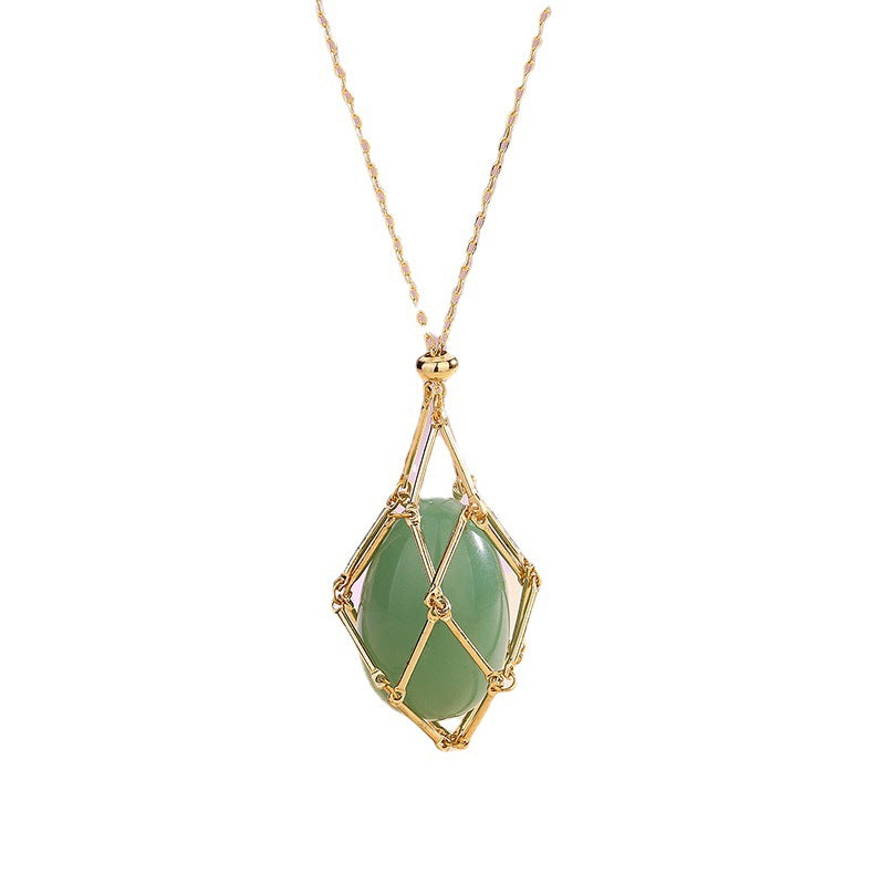 Necklace with a green pendant and gold frame on a white background