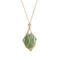 Necklace with a green pendant and gold frame on a white background