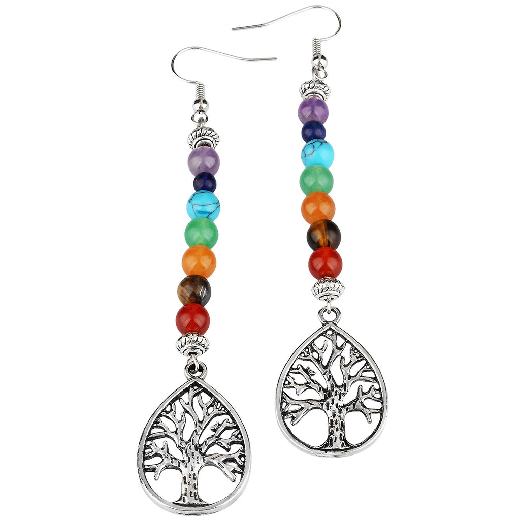 Colorful beaded earrings with tree of life design on a white background