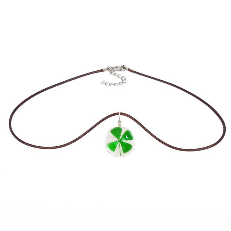 Necklace with a green four-leaf clover pendant on a white background