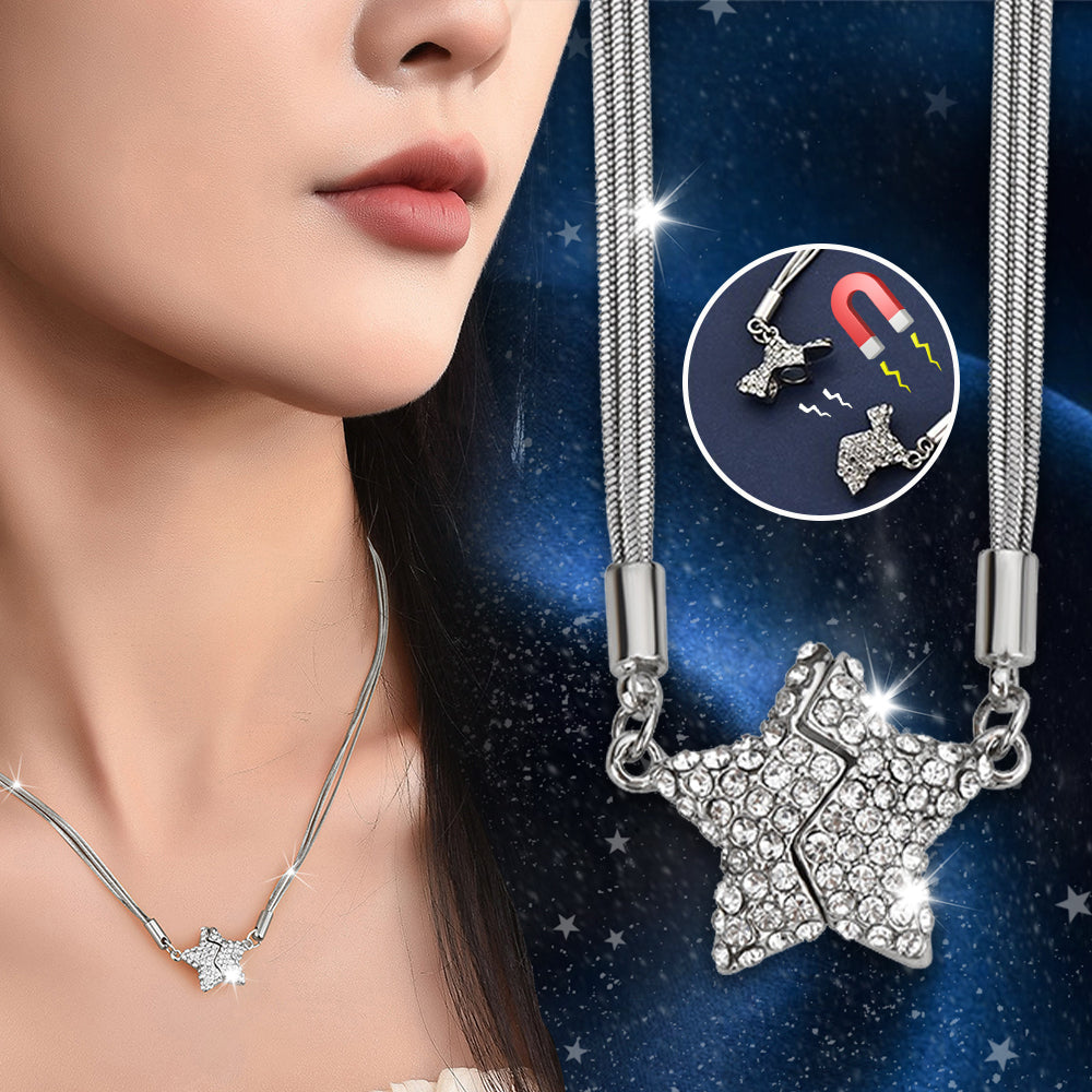 Silver necklace with star-shaped pendant on a model against a starry night sky background