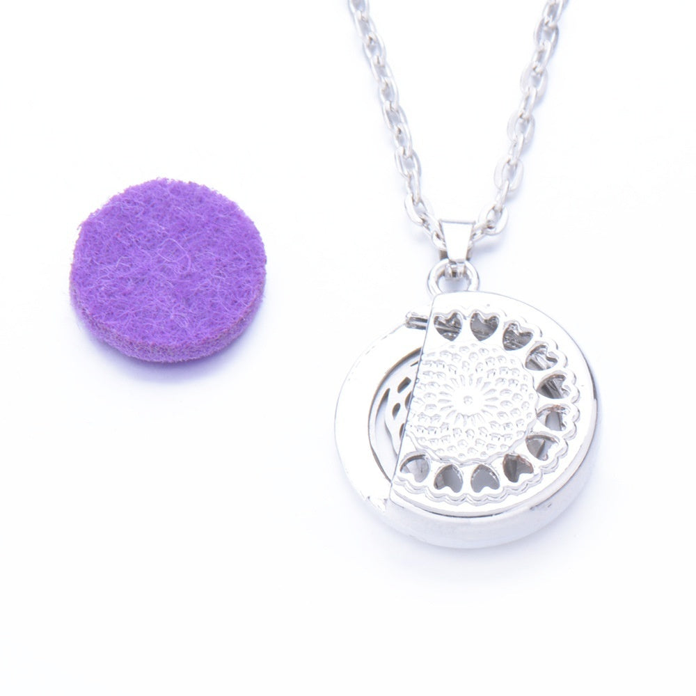 Silver necklace with a heart-shaped pendant on a white background