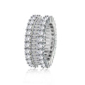 Silver ring with clear gemstones on a white background