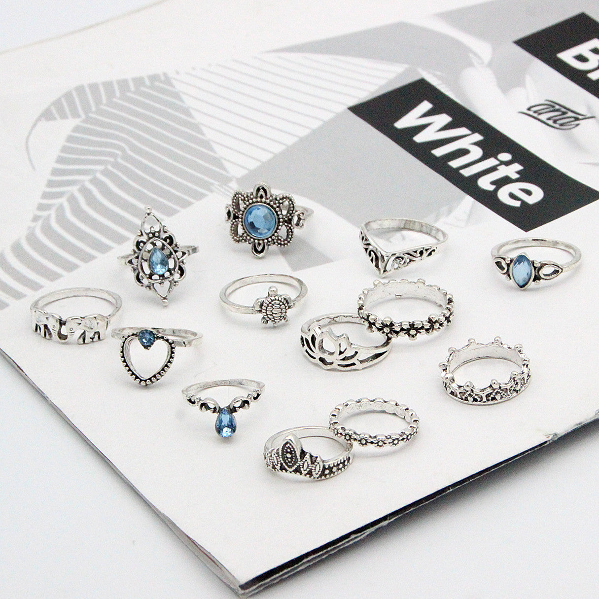 Set of silver rings with blue gemstones on a white box