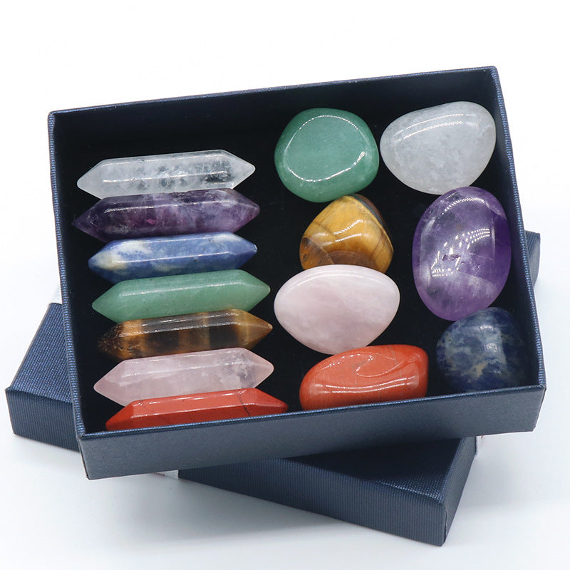 Set of colorful crystals in a black box on a white background