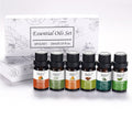 Set of six essential oil bottles with a branded box on a white background