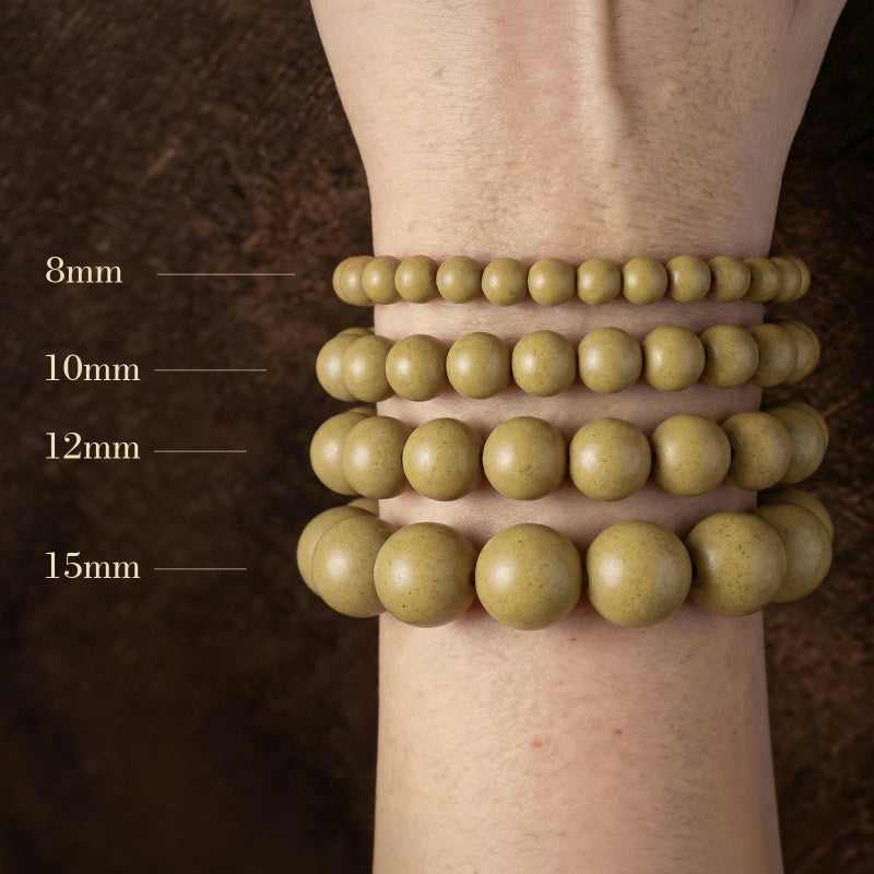 Three green beaded bracelets of different sizes on a wrist with measurements indicated.