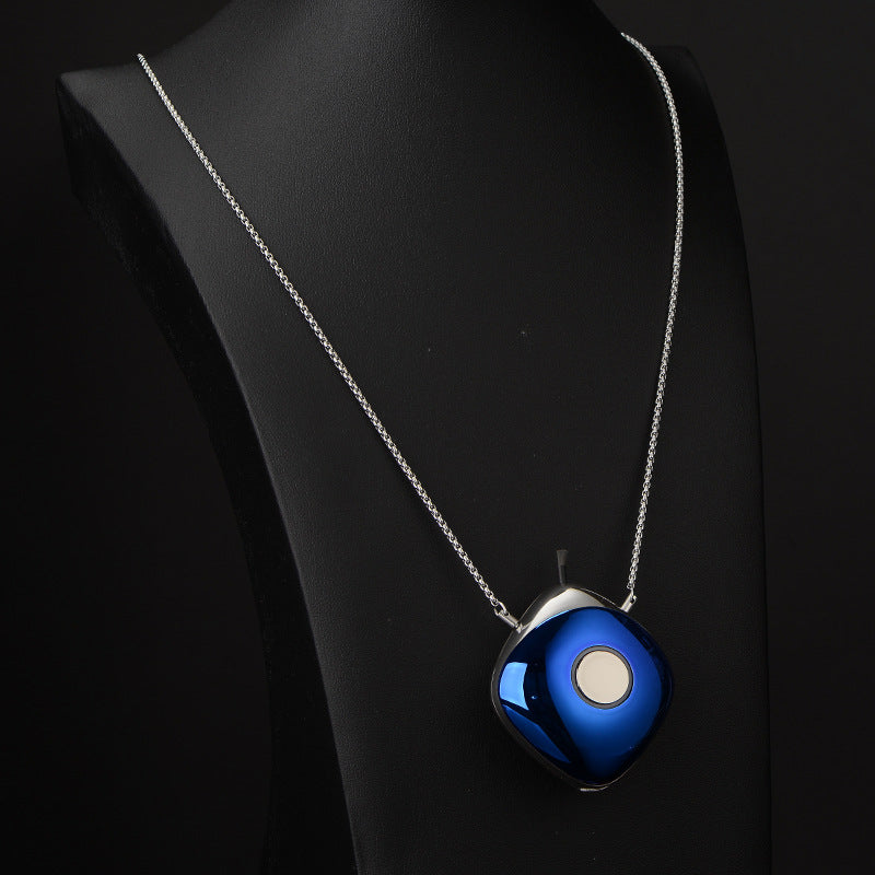 Blue pendant necklace on a black background