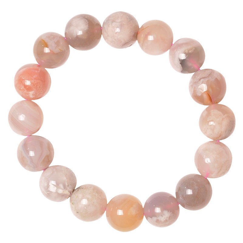 Pink beaded bracelet on a white background