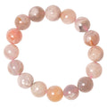 Pink beaded bracelet on a white background