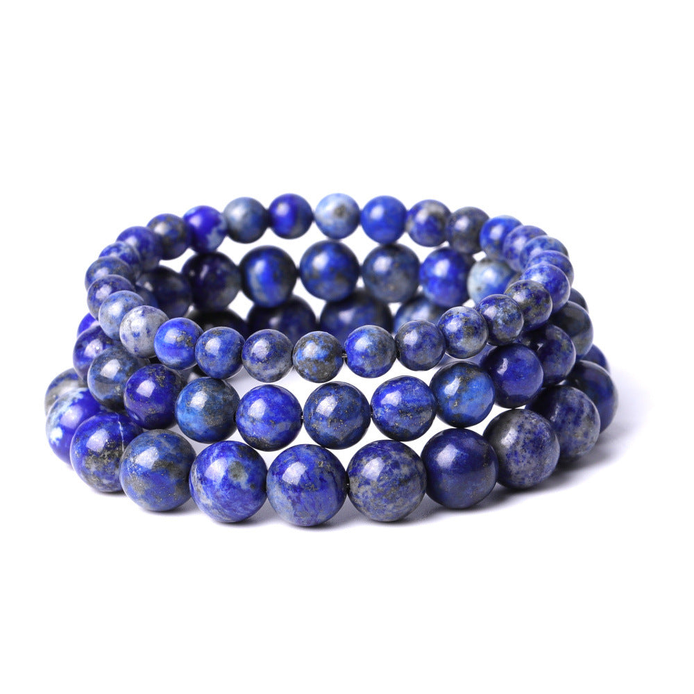 Set of blue beaded bracelets on a white background