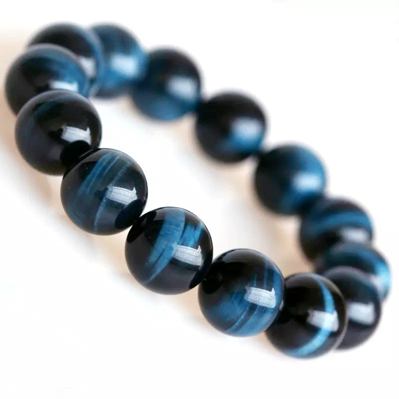 Blue and black beaded bracelet on a white background