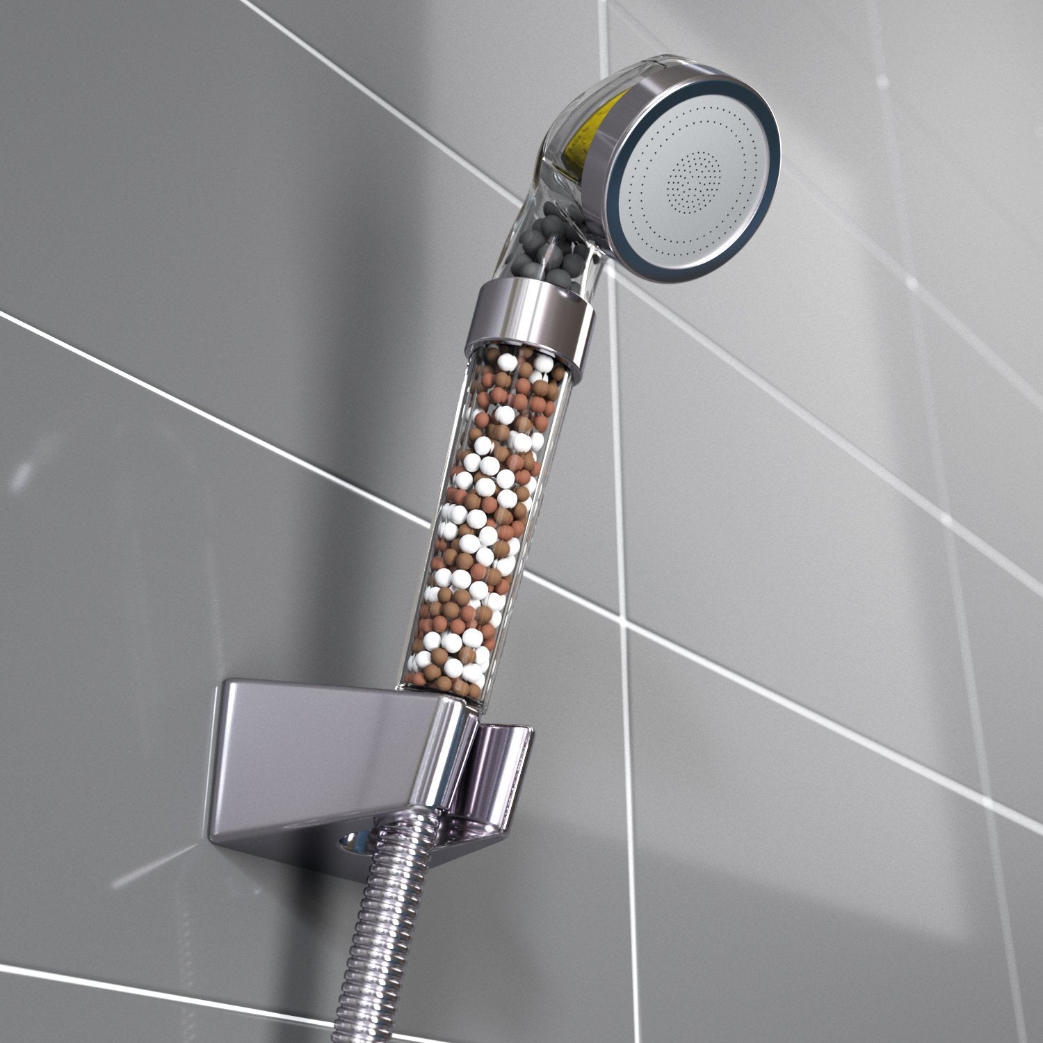 Chrome shower head with filter on a tiled bathroom wall
