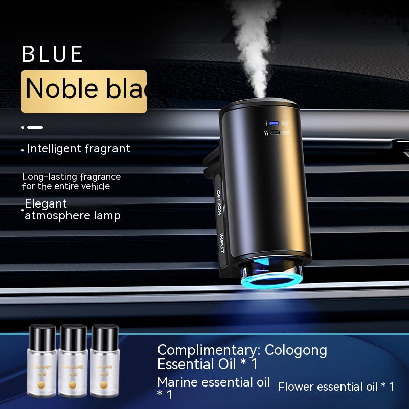 Car air freshener with blue light and steam, placed in a car's air vent.