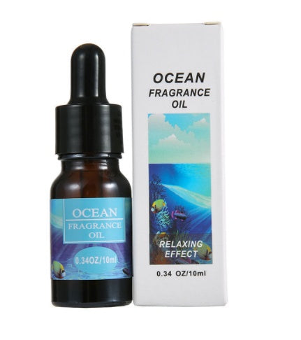 Ocean fragrance oil bottle and packaging on a white background