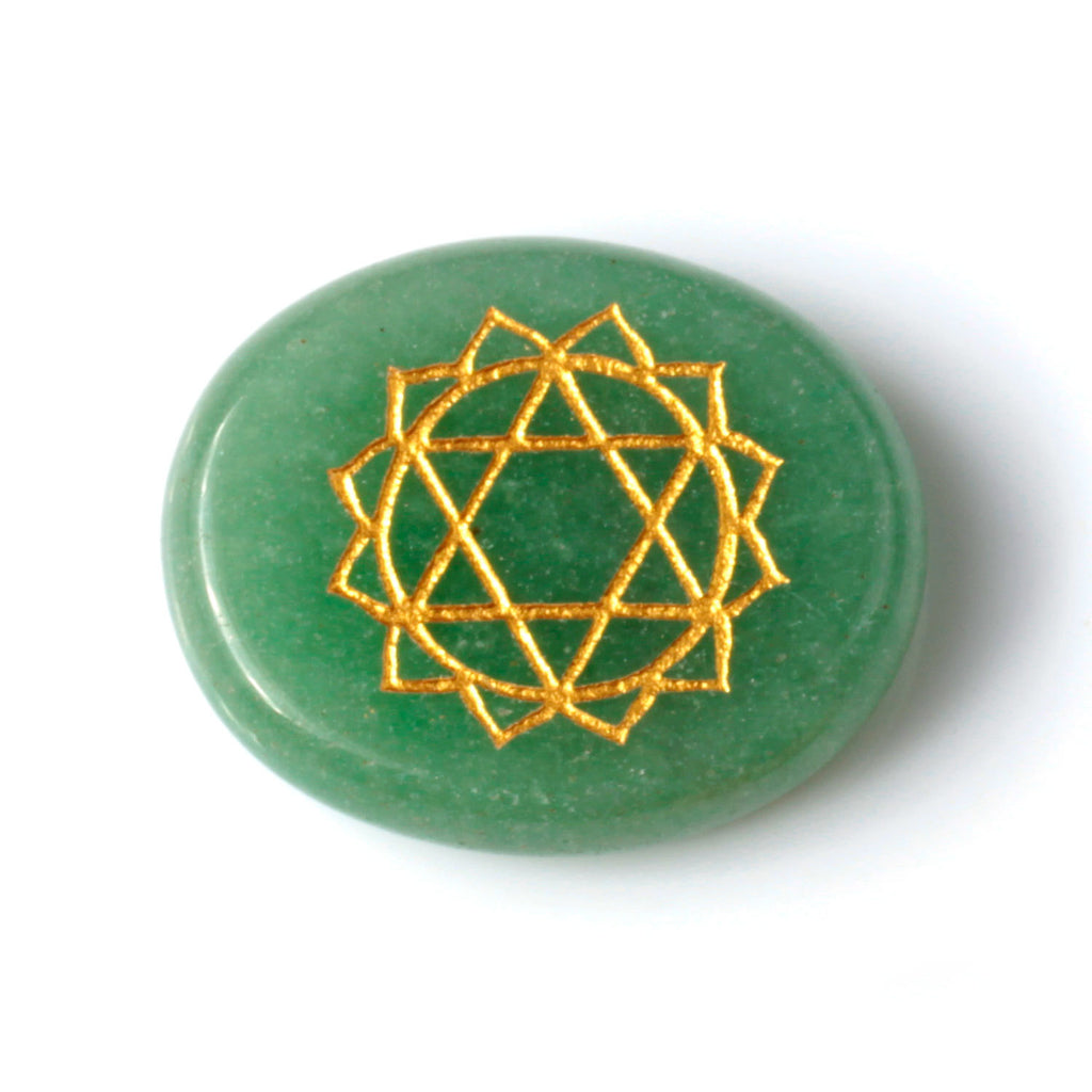 Green stone with a gold geometric pattern on a white background