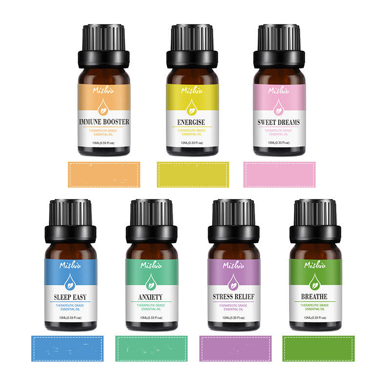Set of essential oil bottles with labels on a white background