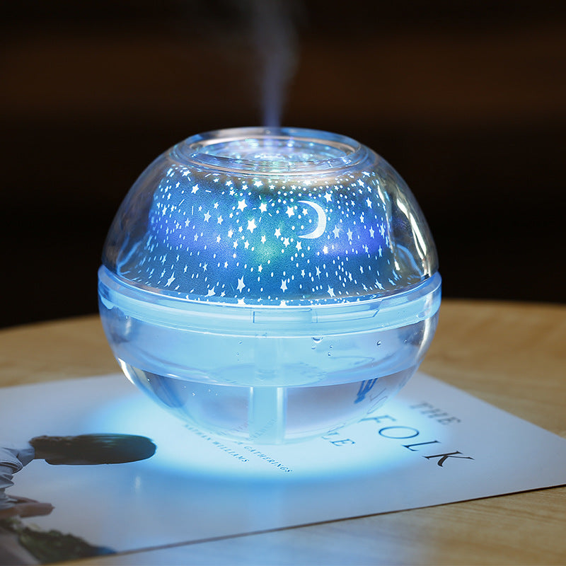 Humidifier emitting mist on a surface with 'The Folk' magazine