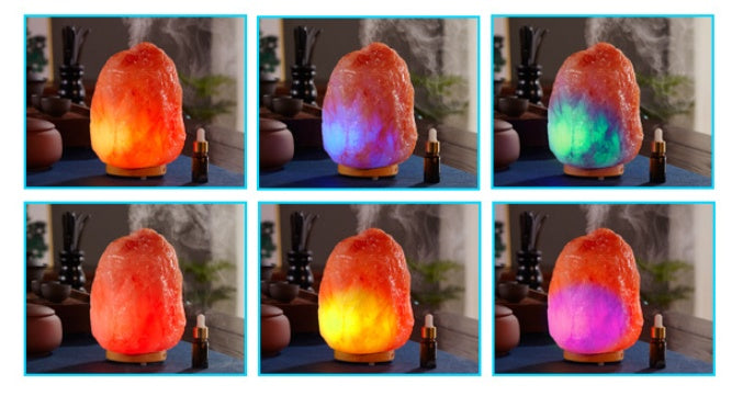 Multicolored salt lamp emitting different colors of light on a table.