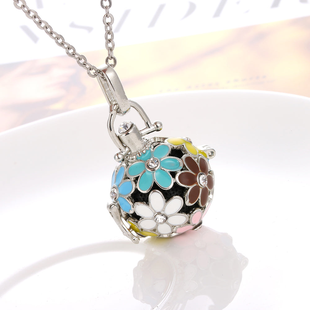 Colorful floral pendant on a chain against a white background