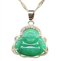 Green Buddha pendant on a gold chain against a white background