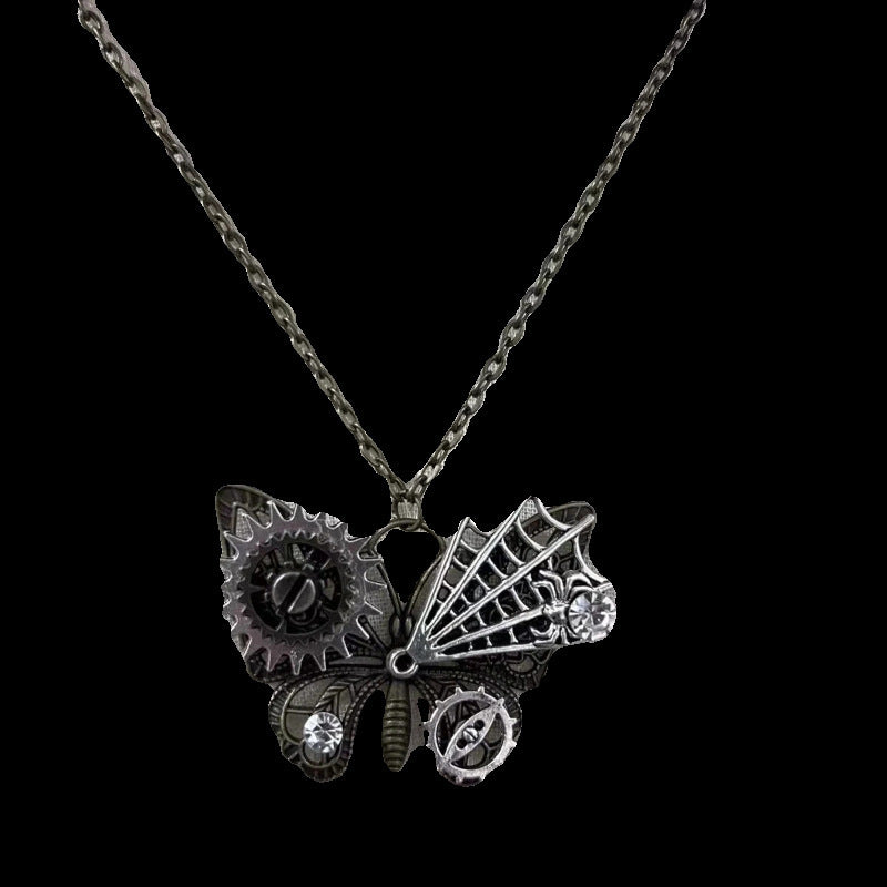Butterfly-shaped pendant with gears on a chain against a black background