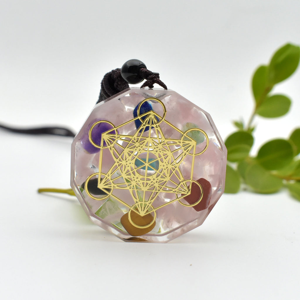 Decorative pendant with geometric design on a white background
