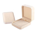 Beige jewelry box with a lid on a white background