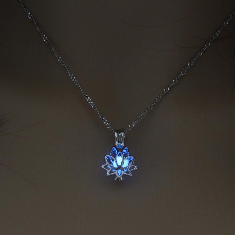 Necklace with a glowing blue lotus flower pendant on a dark background