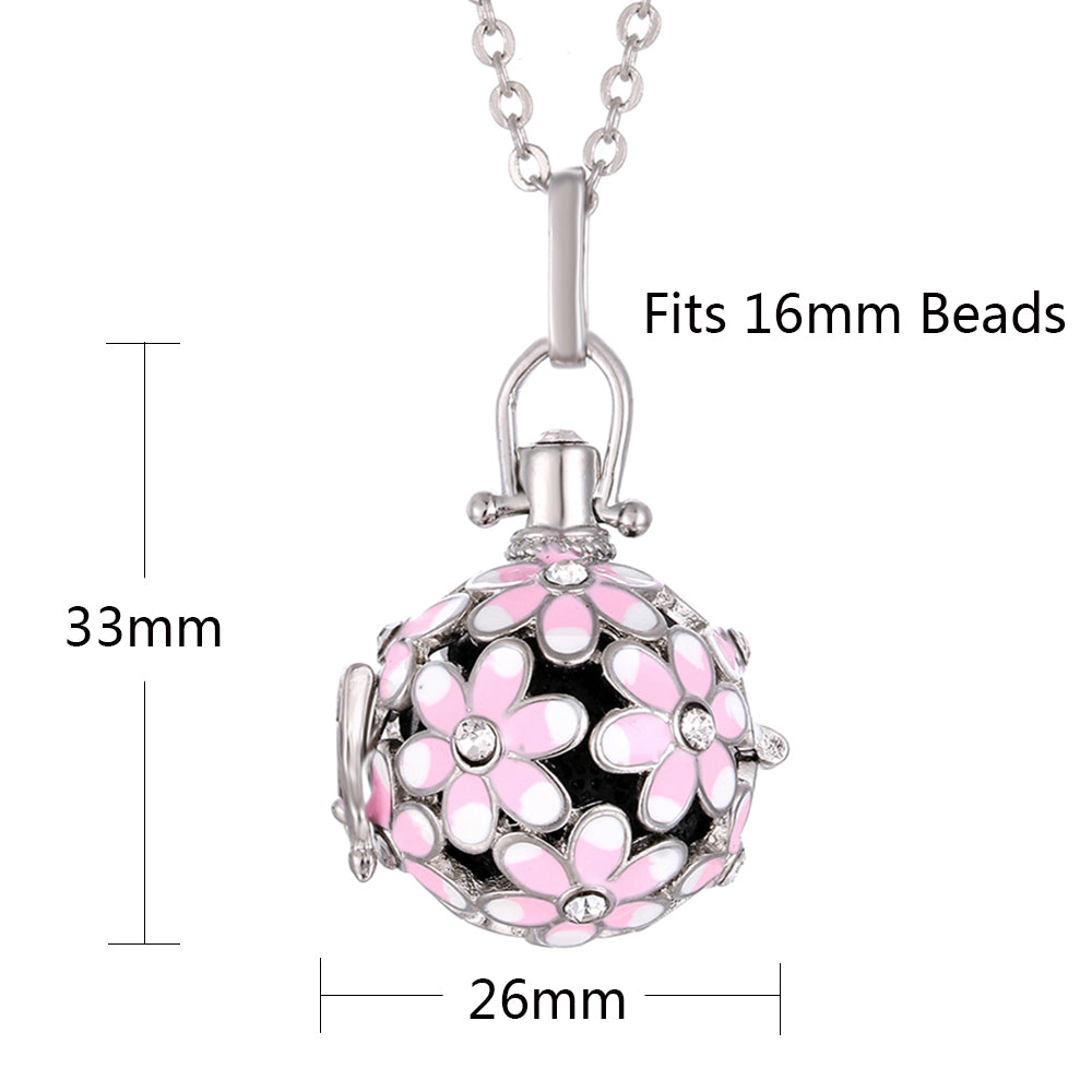 Pink and black floral pendant with measurements on a white background