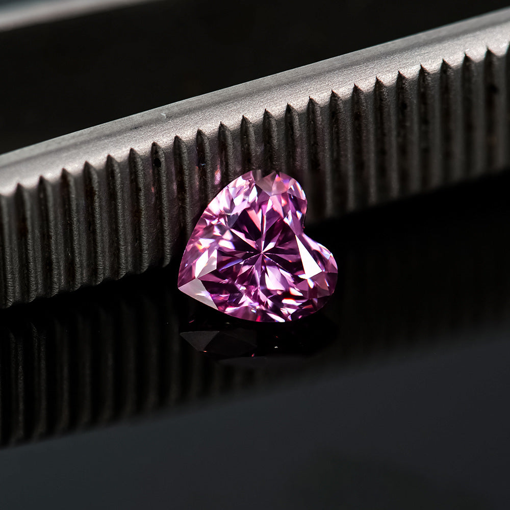 Heart-shaped pink diamond on a dark background
