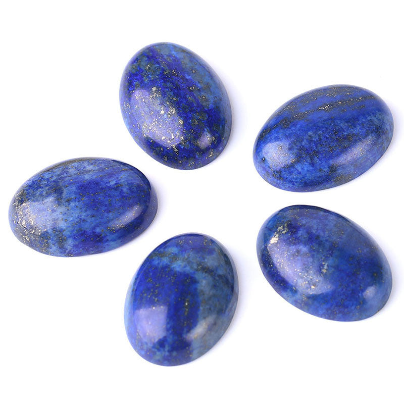 Five blue stones with gold flecks on a white background