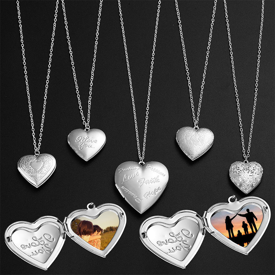 Set of silver heart-shaped necklaces with engraved messages on a black background