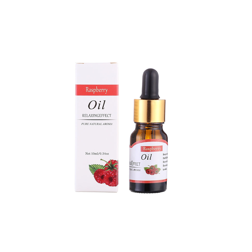 Raspberry oil bottle with dropper and packaging on a white background