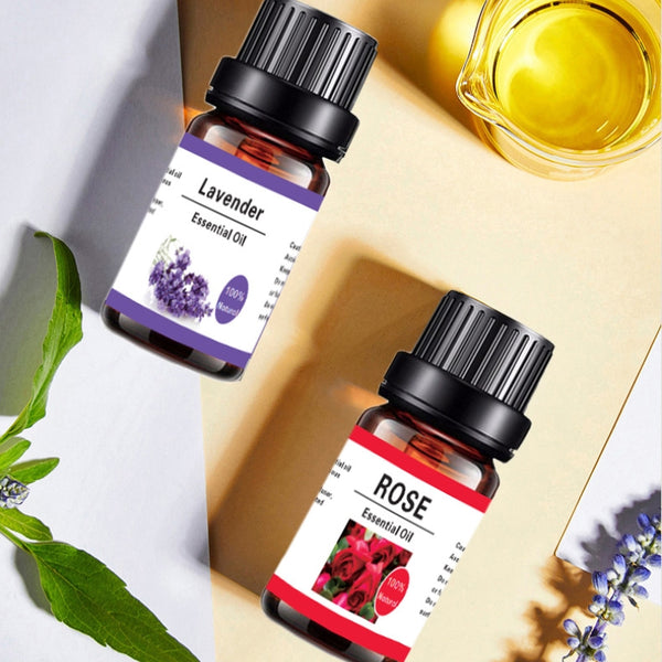 Two essential oil bottles labeled 'Lavender' and 'Rose' with their respective labels on a light background.