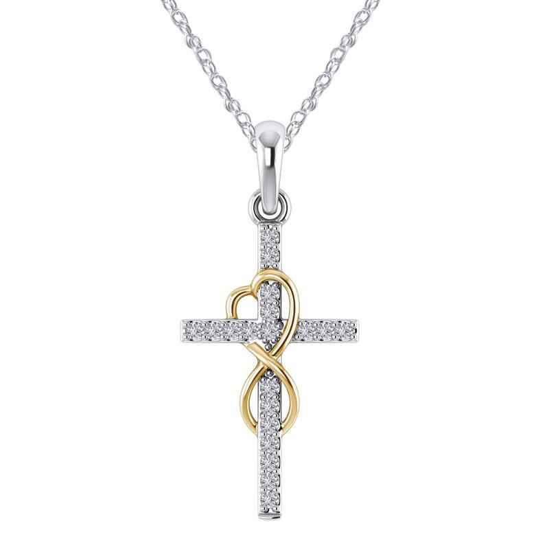Two-tone cross pendant with heart detail on a white background