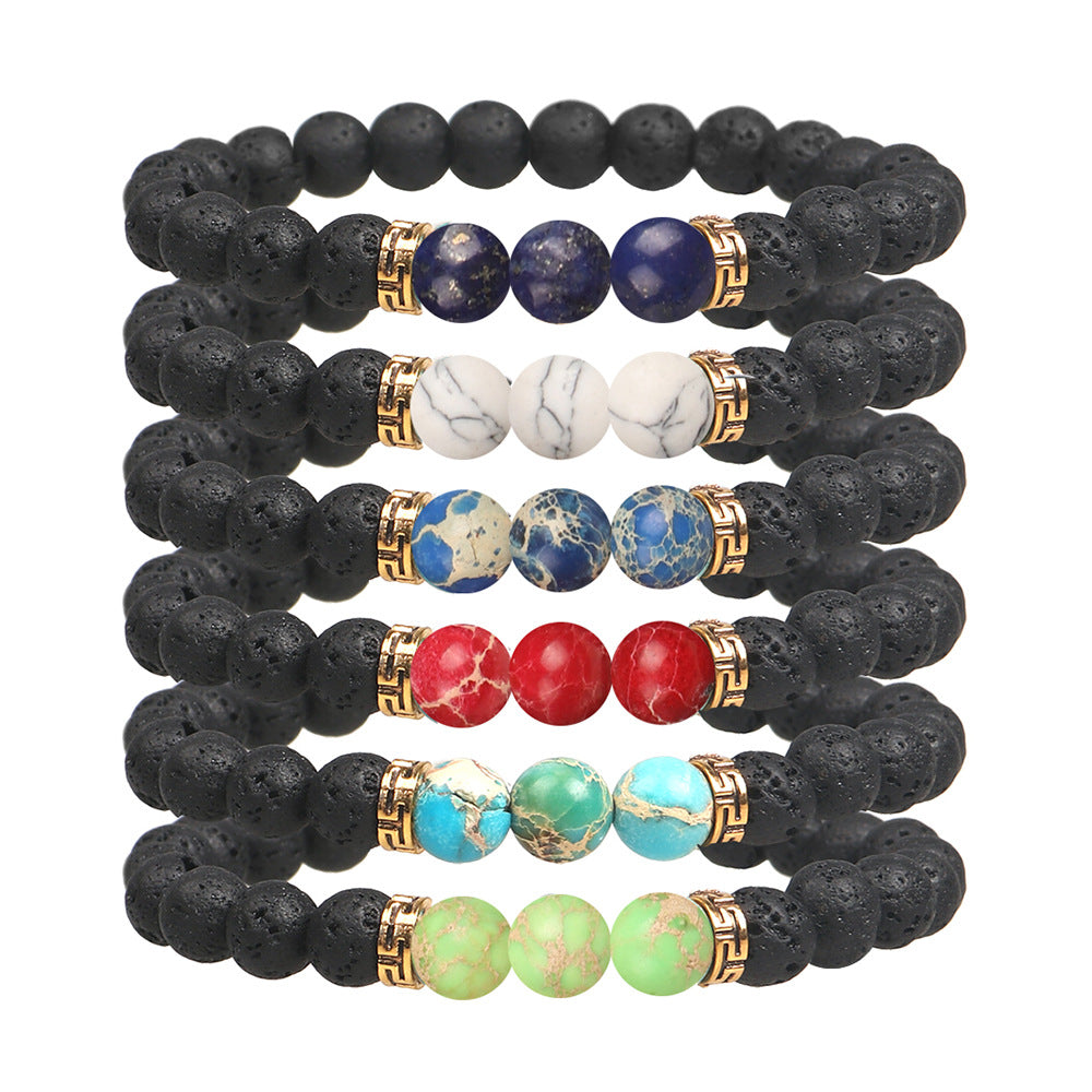 Set of black lava bead bracelets with multicolored stone beads on a white background